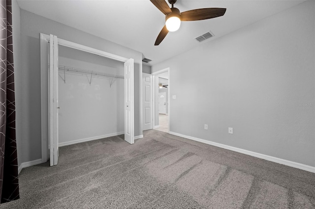 unfurnished bedroom with ceiling fan, a closet, and carpet floors