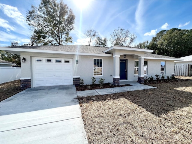 ranch-style house featuring a garage