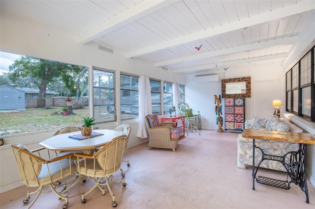 sunroom / solarium featuring a wall mounted air conditioner and beam ceiling