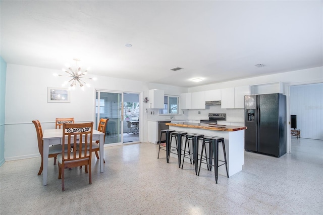 kitchen with a center island, white cabinets, dishwashing machine, black fridge with ice dispenser, and electric stove