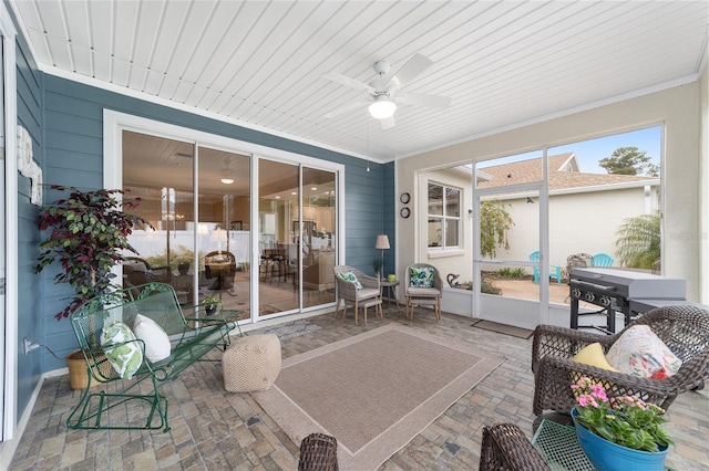 sunroom with wood ceiling, ceiling fan, and plenty of natural light