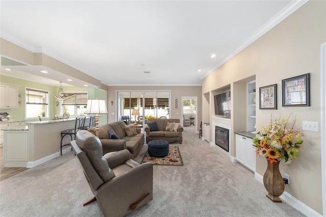 living room featuring crown molding, light colored carpet, and built in shelves