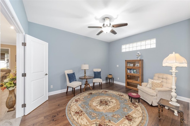 sitting room featuring ceiling fan and dark hardwood / wood-style flooring