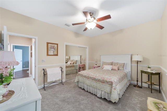 bedroom with ceiling fan and light carpet