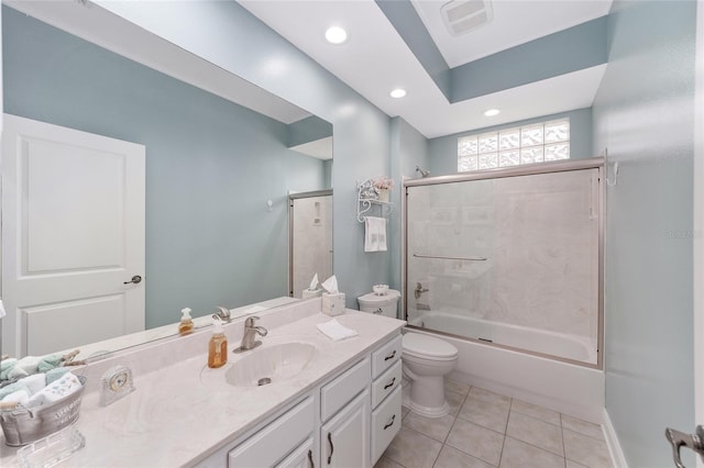 bathroom featuring enclosed tub / shower combo, toilet, vanity, visible vents, and tile patterned floors