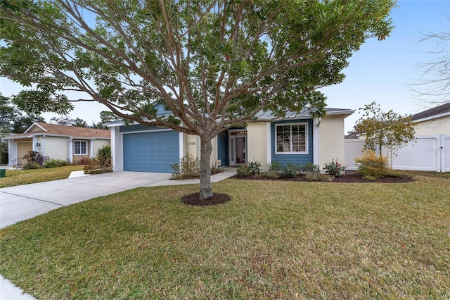 single story home featuring a garage, fence, driveway, stucco siding, and a front lawn