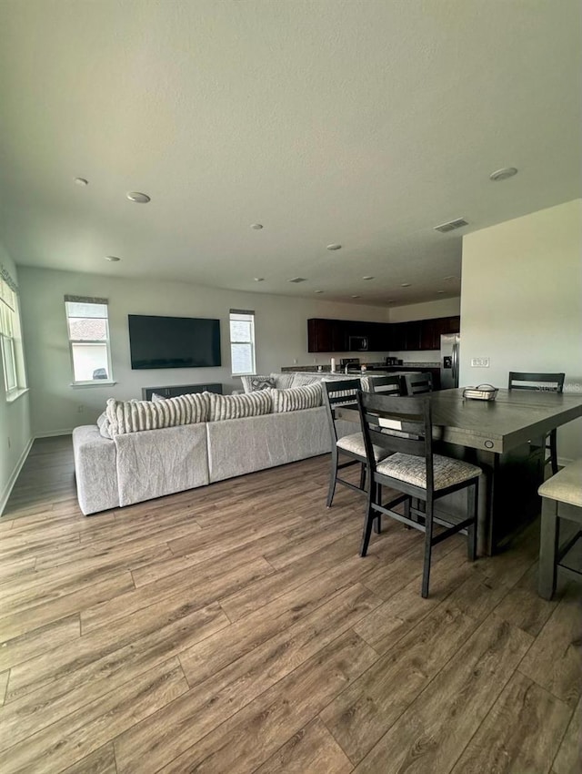 dining space featuring light hardwood / wood-style floors