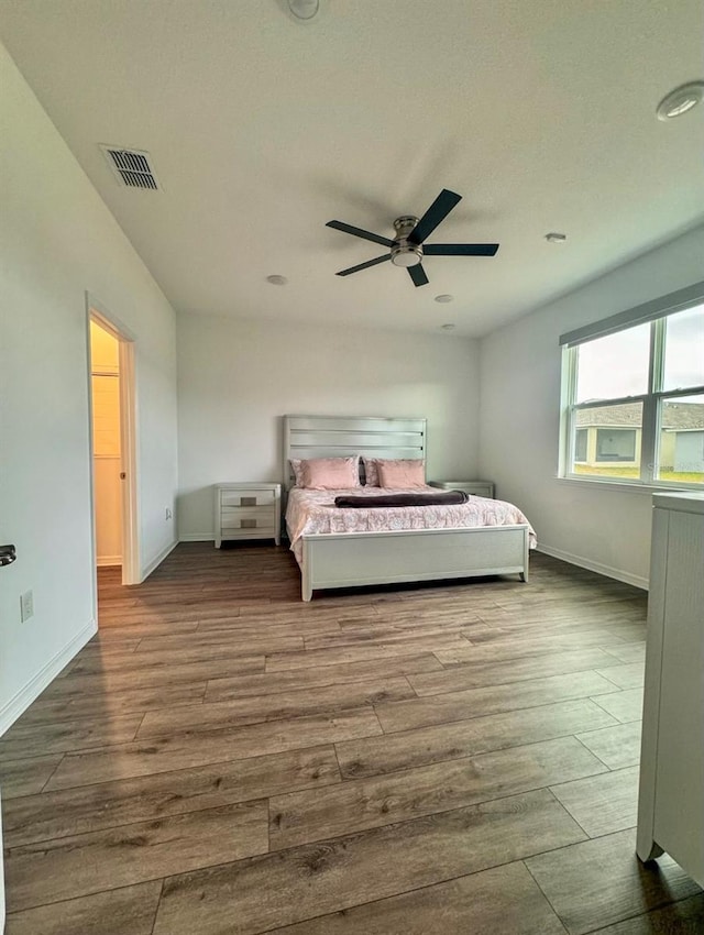 bedroom featuring wood-type flooring and ceiling fan