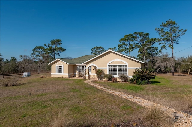 ranch-style home with a front yard