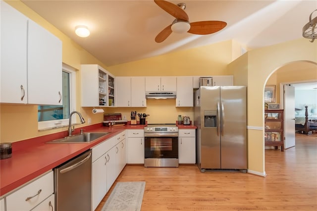 kitchen with white cabinetry, sink, vaulted ceiling, and stainless steel appliances