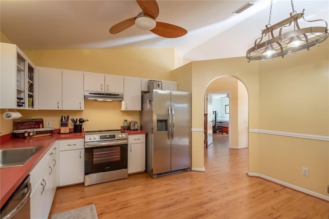 kitchen featuring lofted ceiling, white cabinets, ceiling fan, stainless steel appliances, and light wood-type flooring