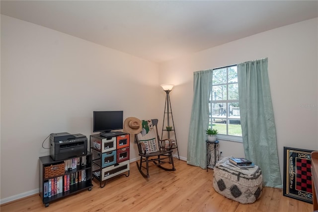 living area with wood-type flooring