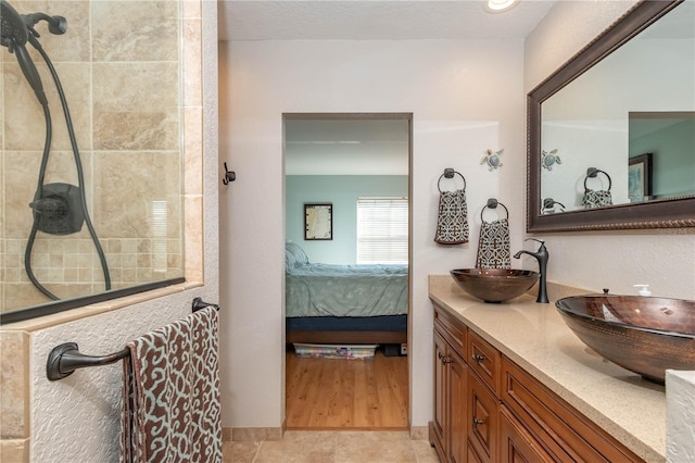 bathroom with vanity and a textured ceiling