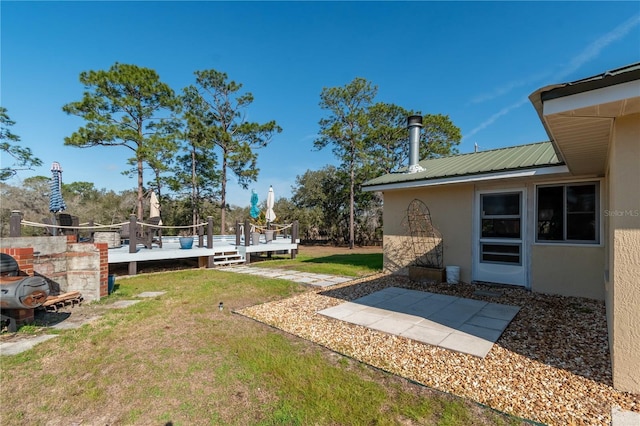 view of yard with a wooden deck