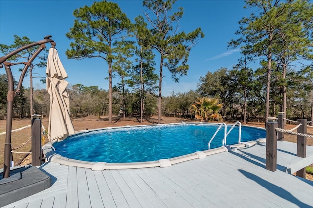 view of pool featuring a wooden deck