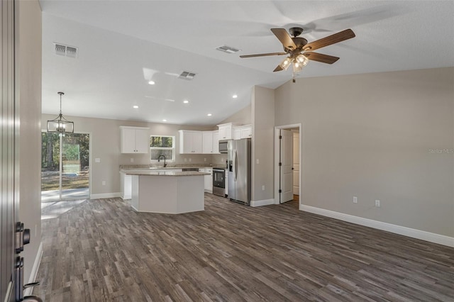 kitchen featuring a kitchen island, white cabinetry, sink, hanging light fixtures, and stainless steel appliances