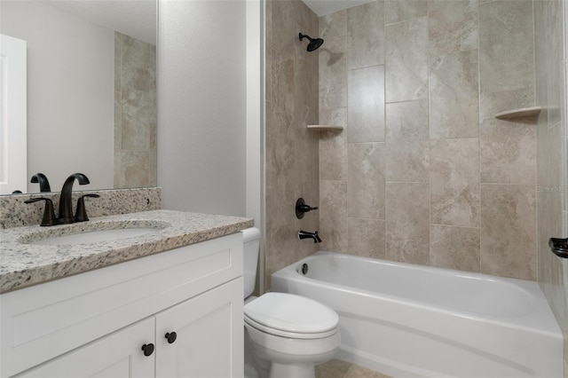 full bathroom with vanity, tiled shower / bath combo, and toilet