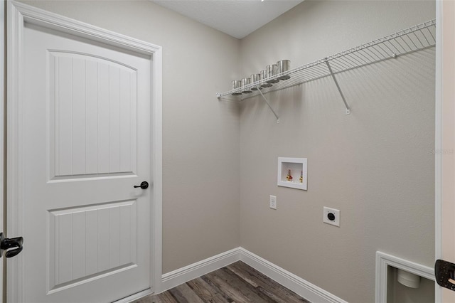 laundry area with hookup for a washing machine, dark hardwood / wood-style floors, and hookup for an electric dryer