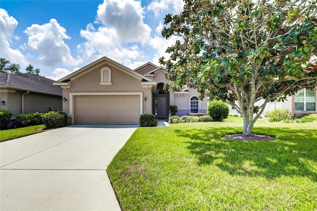 view of front of house featuring a front yard and a garage