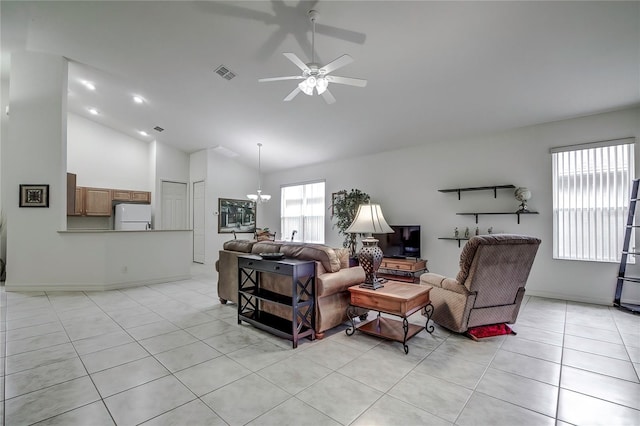 tiled living room featuring vaulted ceiling and ceiling fan