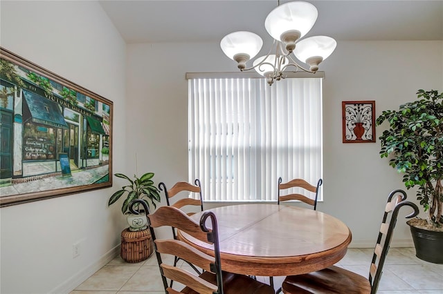 tiled dining area featuring an inviting chandelier