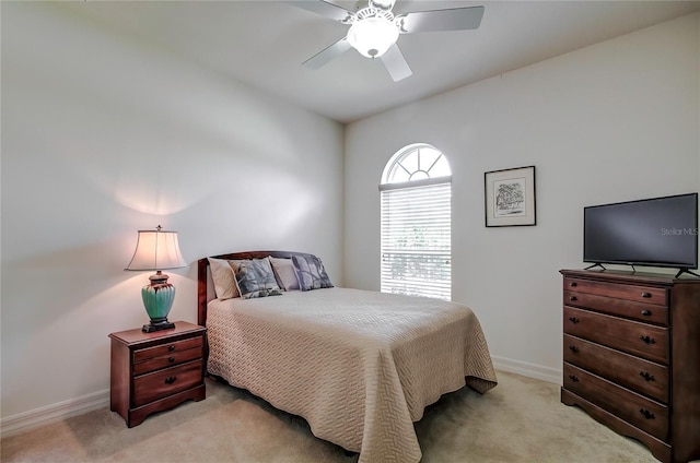 bedroom featuring light carpet and ceiling fan