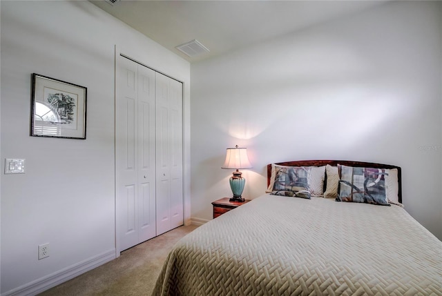 carpeted bedroom with a closet