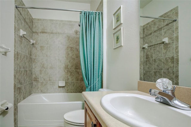 full bathroom featuring vanity, toilet, and shower / tub combo