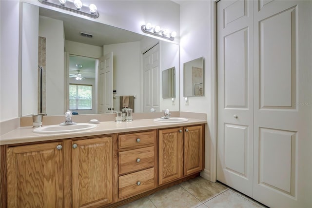 bathroom featuring ceiling fan, vanity, and tile patterned flooring