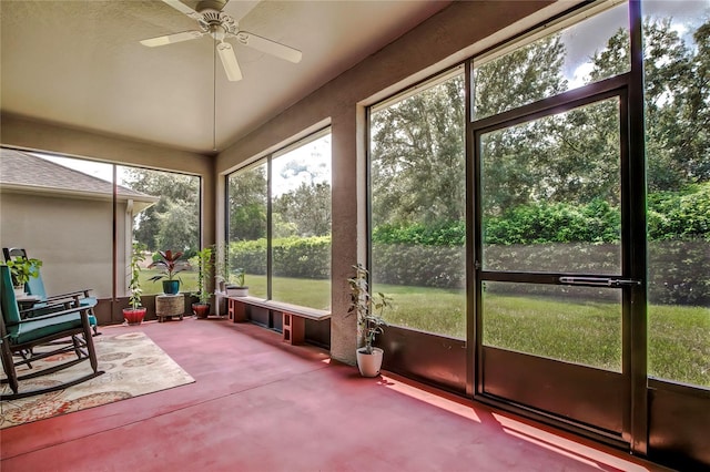 sunroom with ceiling fan and a wealth of natural light