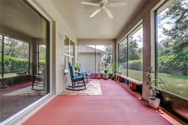 sunroom / solarium featuring ceiling fan