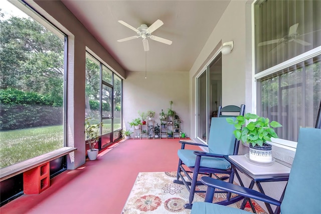 sunroom / solarium featuring ceiling fan