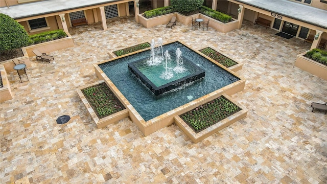 view of swimming pool with pool water feature