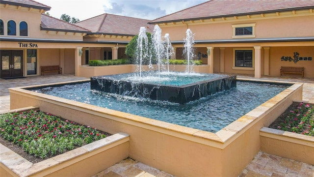 view of pool featuring pool water feature