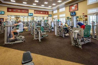 exercise room with a high ceiling