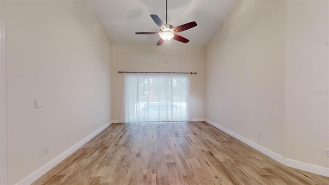 unfurnished room with light hardwood / wood-style floors, high vaulted ceiling, and ceiling fan