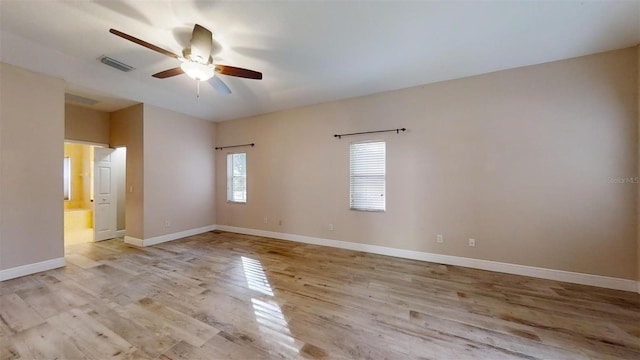 empty room with light wood-type flooring and ceiling fan