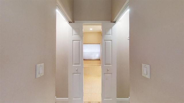 corridor with tile patterned flooring