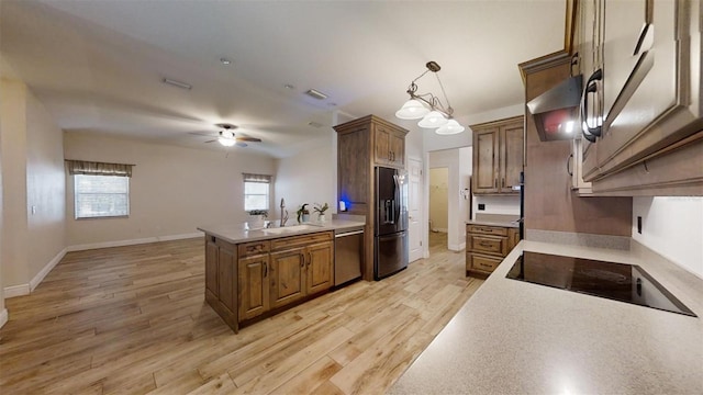 kitchen with black electric stovetop, dishwasher, sink, light wood-type flooring, and refrigerator with ice dispenser