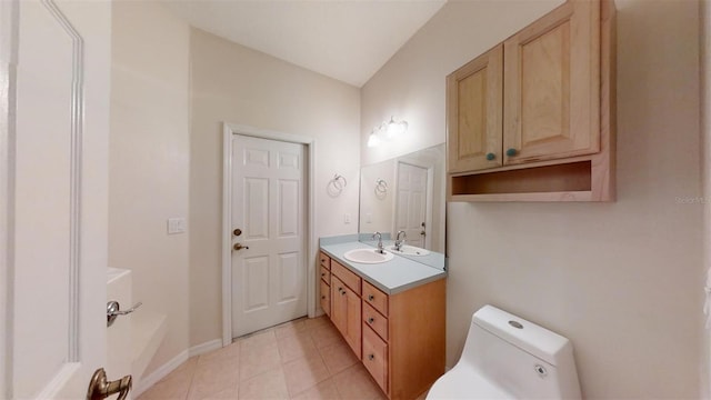 bathroom featuring toilet, tile patterned flooring, and vanity