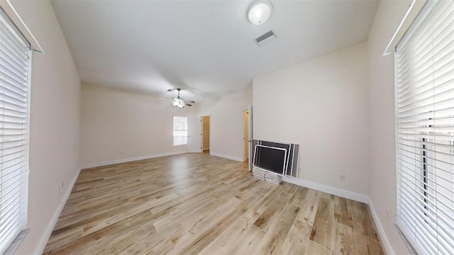 unfurnished living room with light hardwood / wood-style floors and ceiling fan