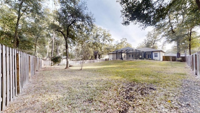 view of yard with a lanai