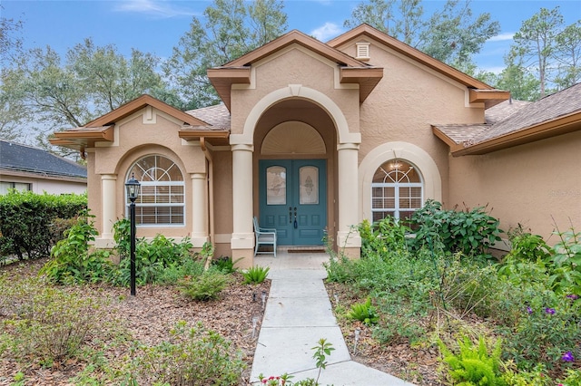 property entrance featuring french doors