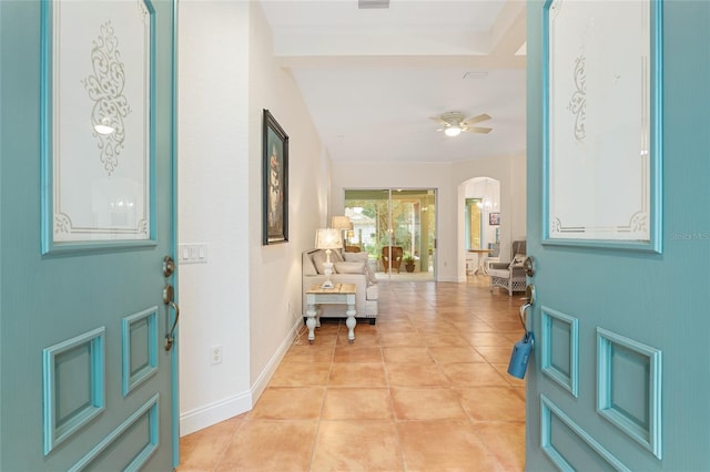 tiled entrance foyer featuring ceiling fan