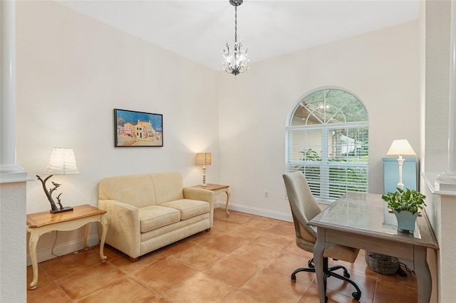 office space with an inviting chandelier and light tile patterned floors