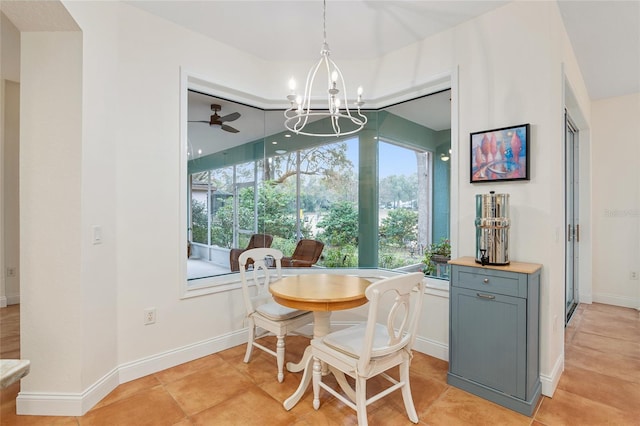 dining area with light tile patterned floors and a notable chandelier