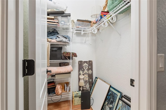 spacious closet with tile patterned floors