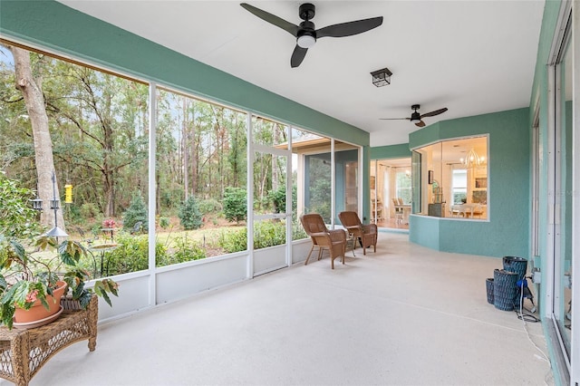 sunroom / solarium with ceiling fan