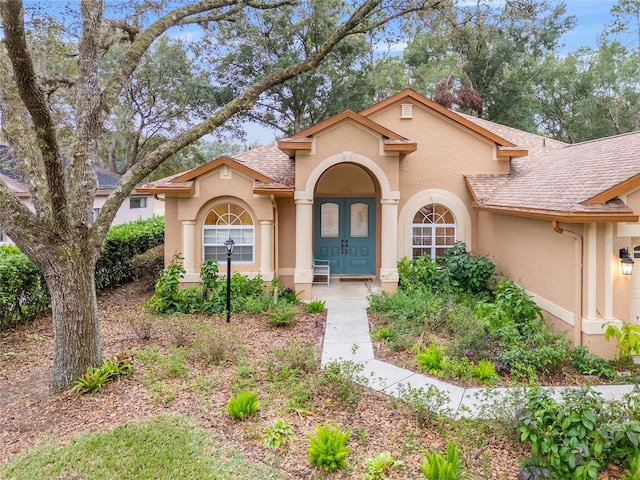 mediterranean / spanish home with french doors