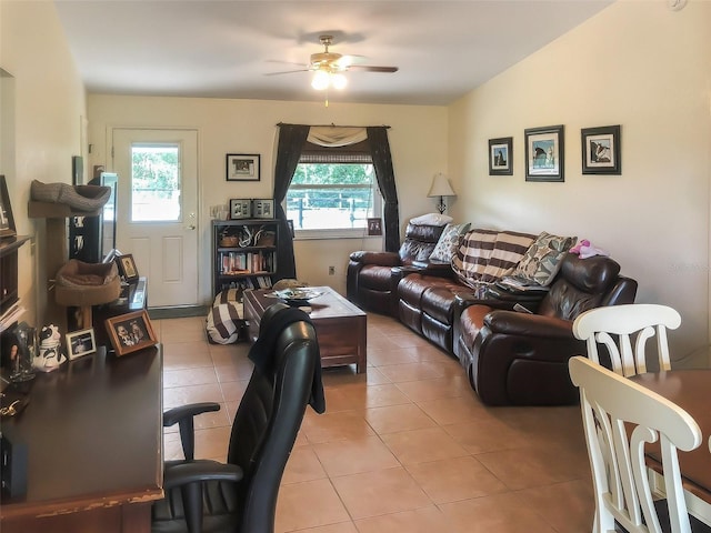 living room with ceiling fan, light tile patterned floors, and a wealth of natural light